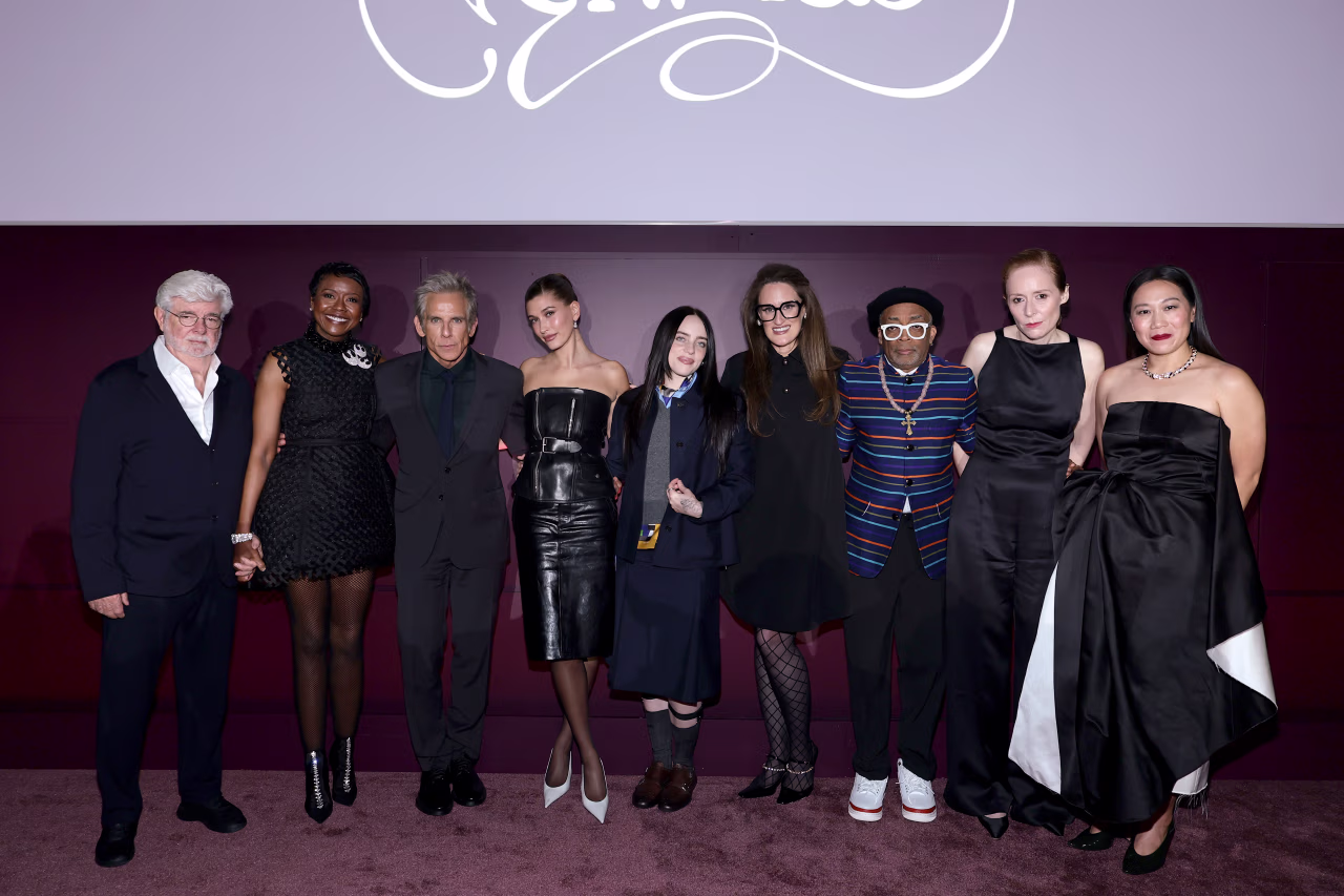 Billie Eilish posing on the red carpet with fellow stars at the WSJ Innovator Awards.