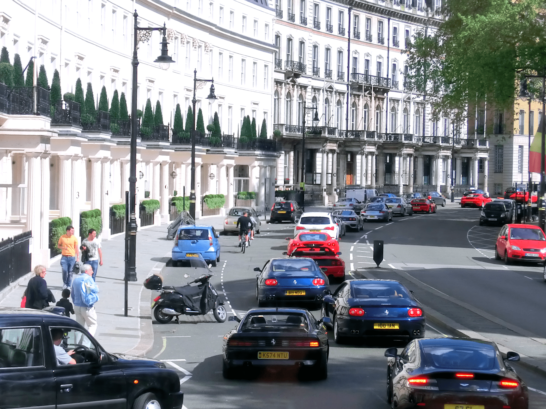 Traffic jam of luxury supercars leaving Kensington, representing the exodus of wealthy residents from London.
