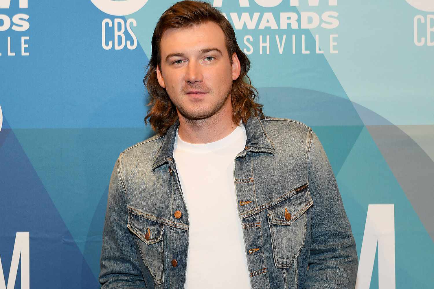 Morgan Wallen on the red carpet wearing a denim jacket