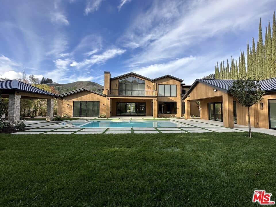 Exterior of Nicki Minaj’s Hidden Hills mansion, a sprawling 11-bedroom estate with gated entry and landscaped grounds.