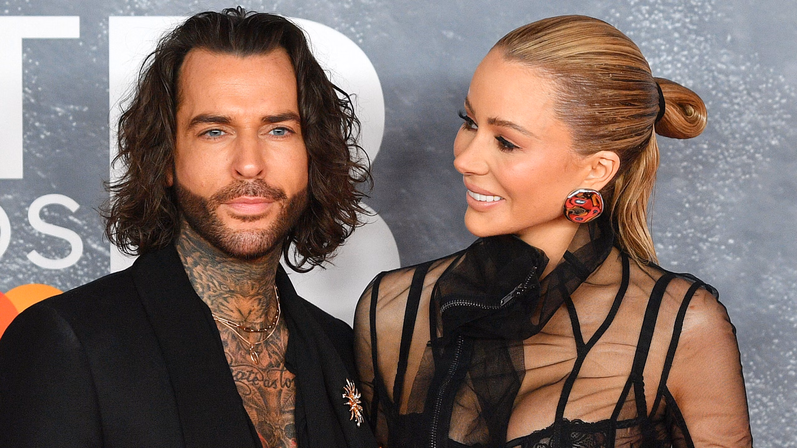 Olivia Attwood posing on the red carpet with friend Pete Wicks.