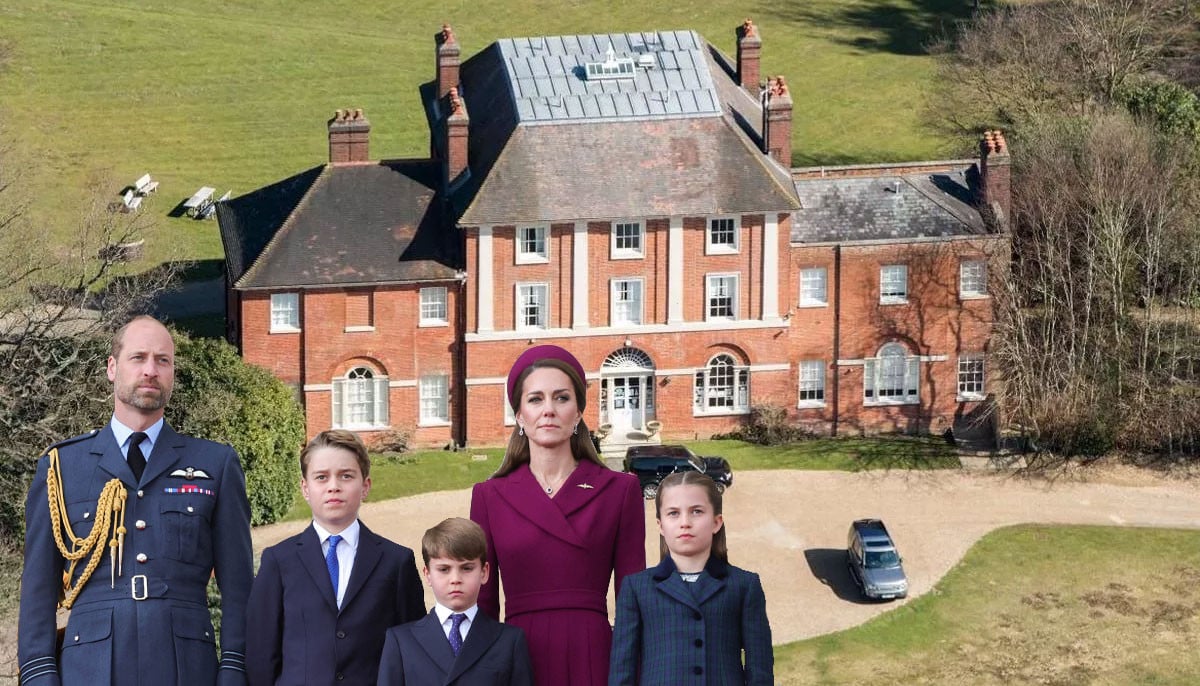 Prince William, Kate Middleton, and their three children standing in front of Forest Lodge in Windsor Great Park.