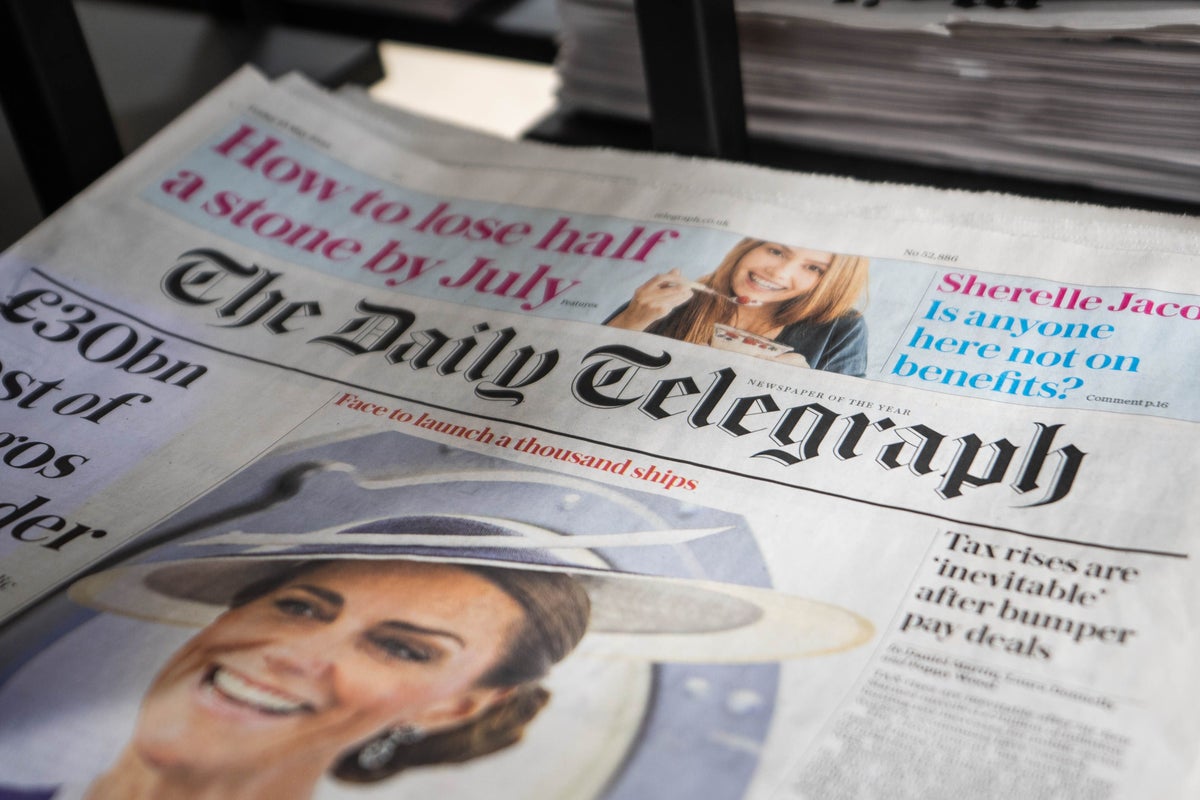 Front page of the Daily Telegraph newspaper displayed on a newsstand.
