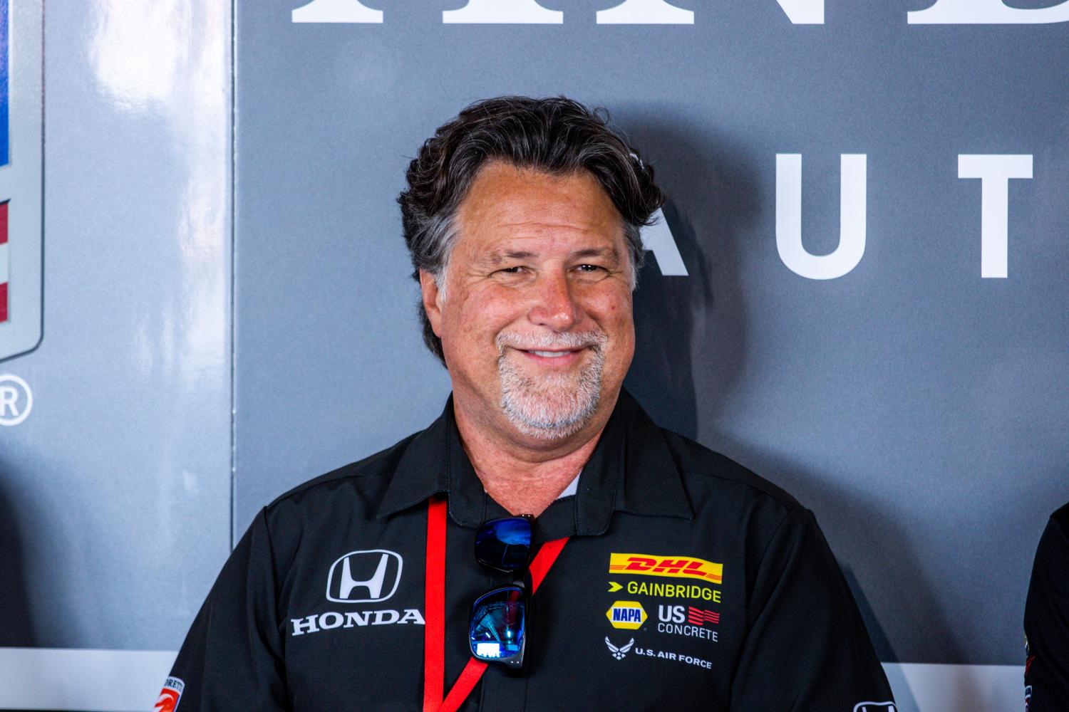 Michael Andretti smiling while attending a race event.