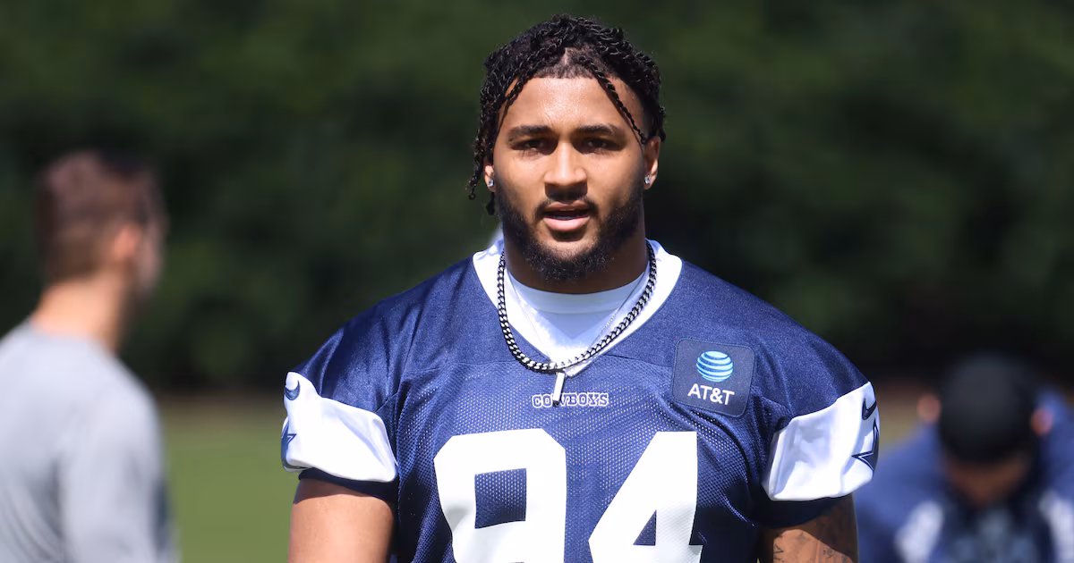 Marshawn Kneeland in Dallas Cowboys training gear looking at the camera during practice.