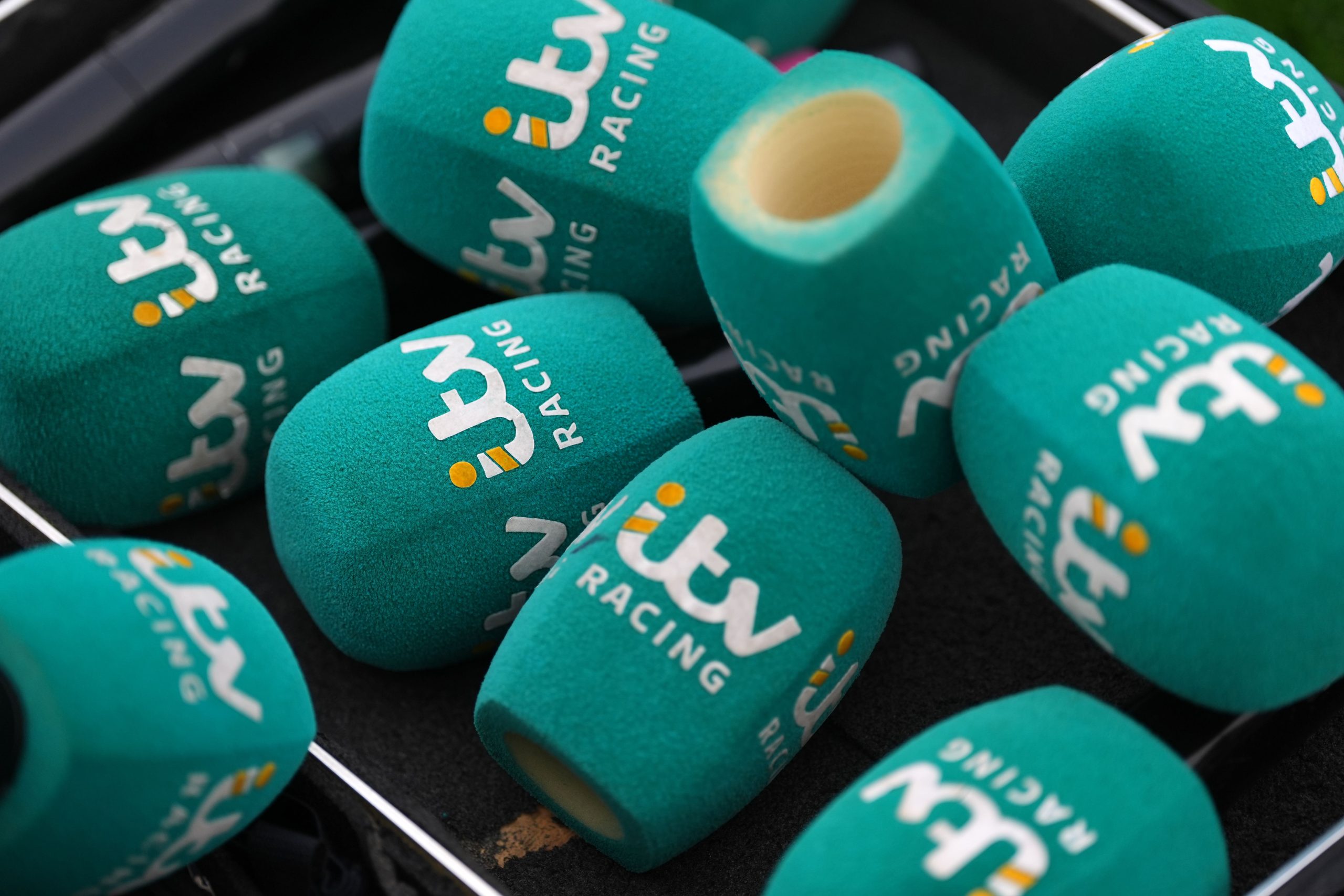 "A box filled with ITV-branded microphone covers, ready for reporters ahead of major broadcasting events.