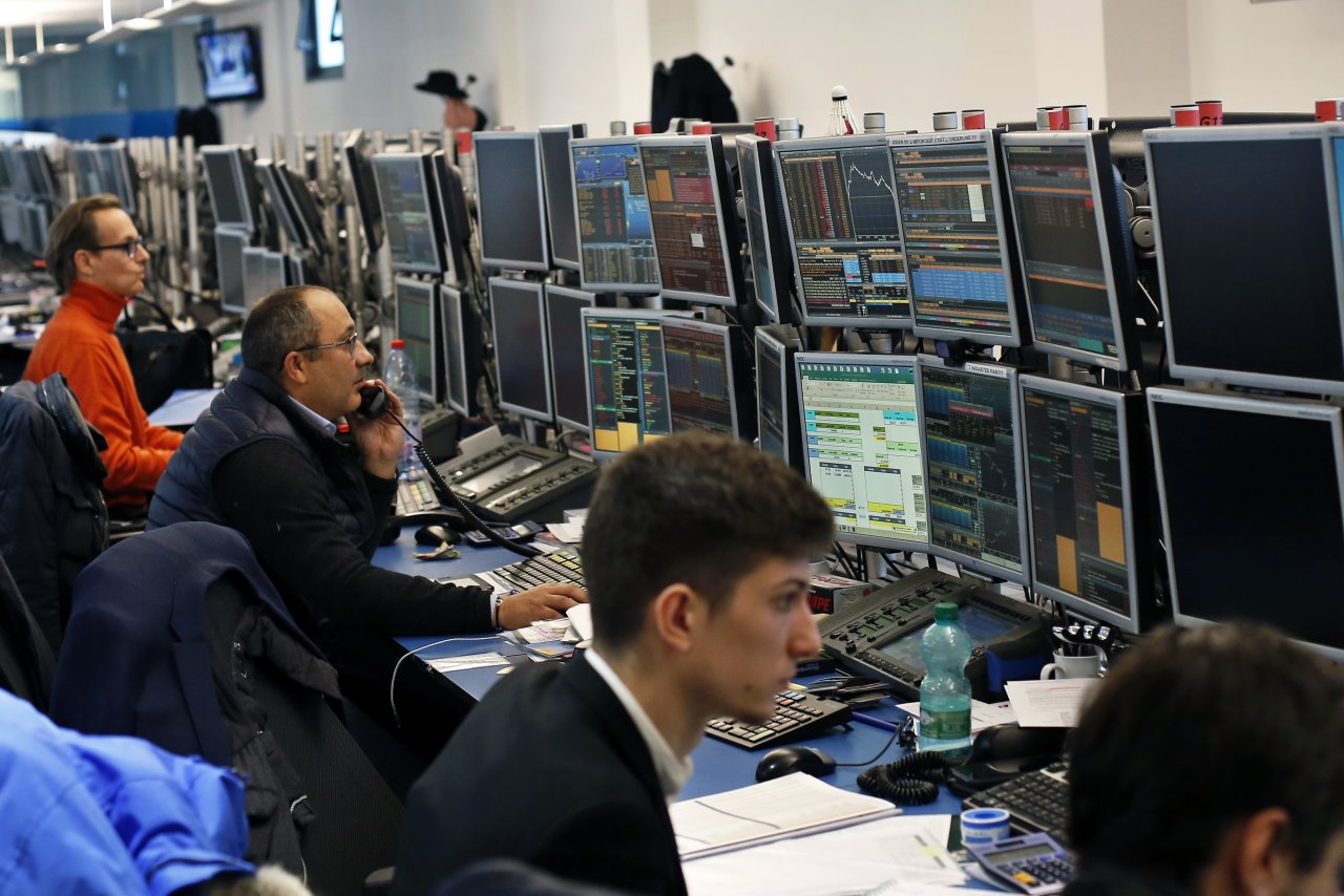 Nvidia headquarters with stock market screen reflecting pre-earnings volatility