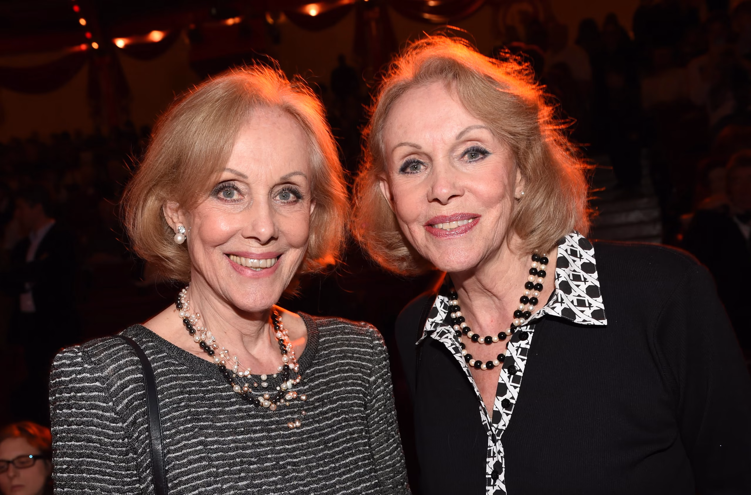 Alice and Ellen Kessler, the iconic twin entertainers, beaming with joy in a recent photo from their Grünwald home, embodying the unbreakable bond and graceful legacy that defined their $8 million fortune and charitable farewell.