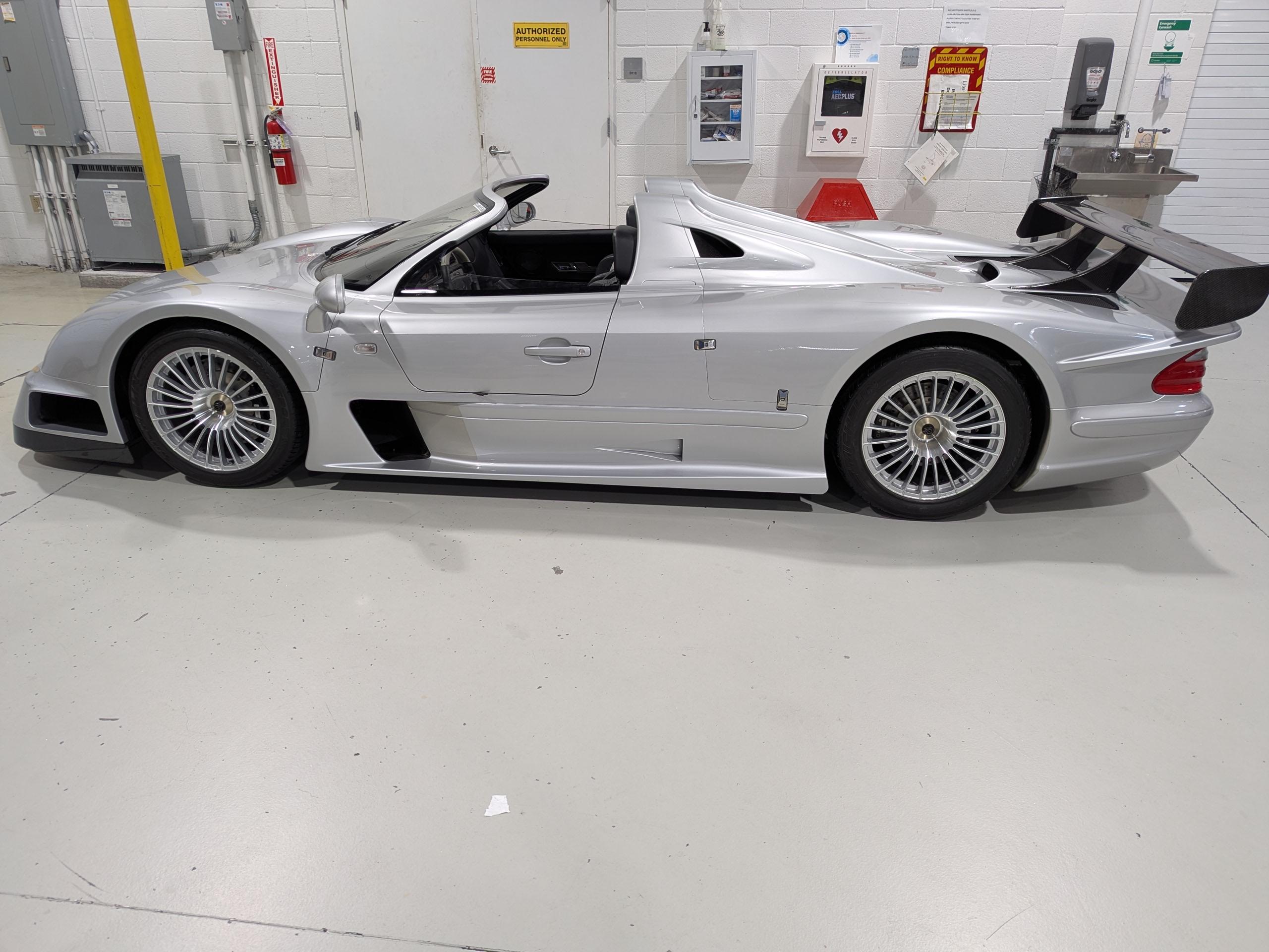 Side view of the ultra-rare 2002 Mercedes-Benz CLK-GTR Roadster seized by the FBI, showcasing its low aerodynamic profile and distinctive racing-inspired design.