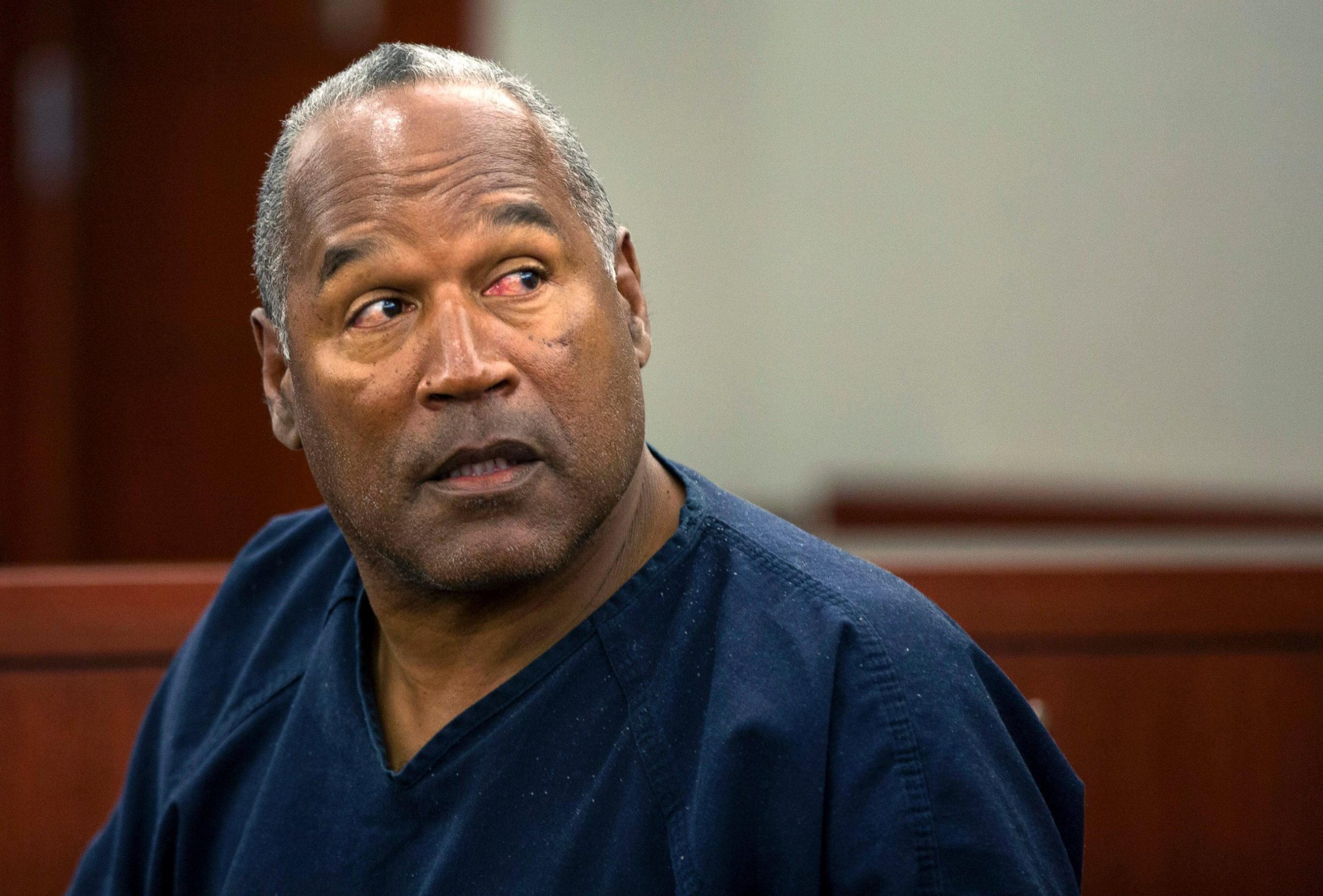An older O.J. Simpson sitting in a courtroom, reflecting on decades of legal proceedings stemming from the 1994 murders of Nicole Brown Simpson and Ron Goldman.