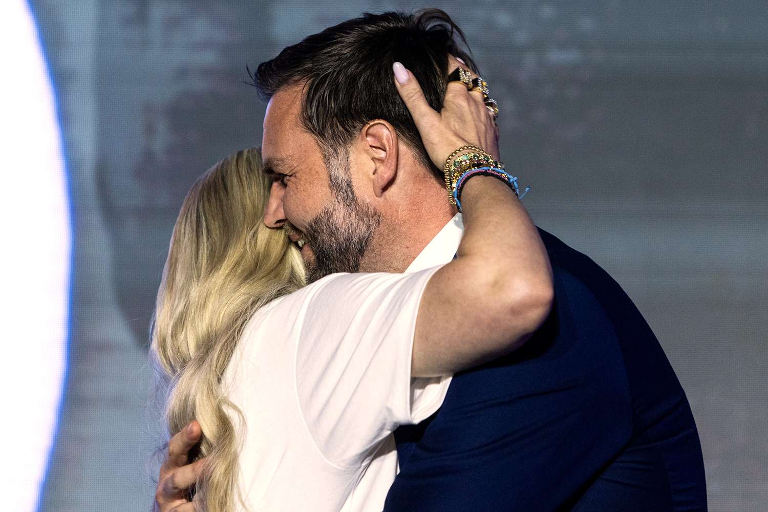 Erika Kirk and JD Vance sharing a controversial hug at a public event.