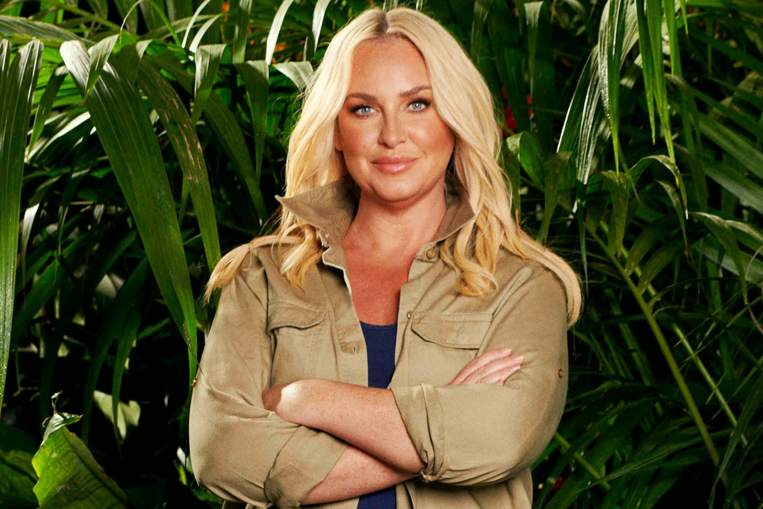 Josie Gibson posing in the I’m A Celebrity… Get Me Out Of Here! jungle, wearing casual outdoor attire suitable for the show’s challenges.