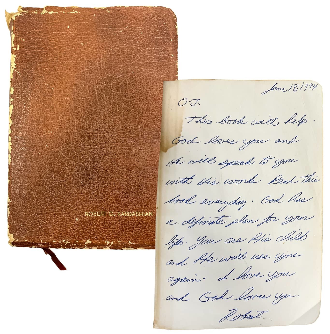 Close-up image of Robert Kardashian’s gifted Bible, showing its worn leather cover, handwritten inscription, and the highlighted passages that connect the Kardashian family back to the O.J. Simpson trial era.