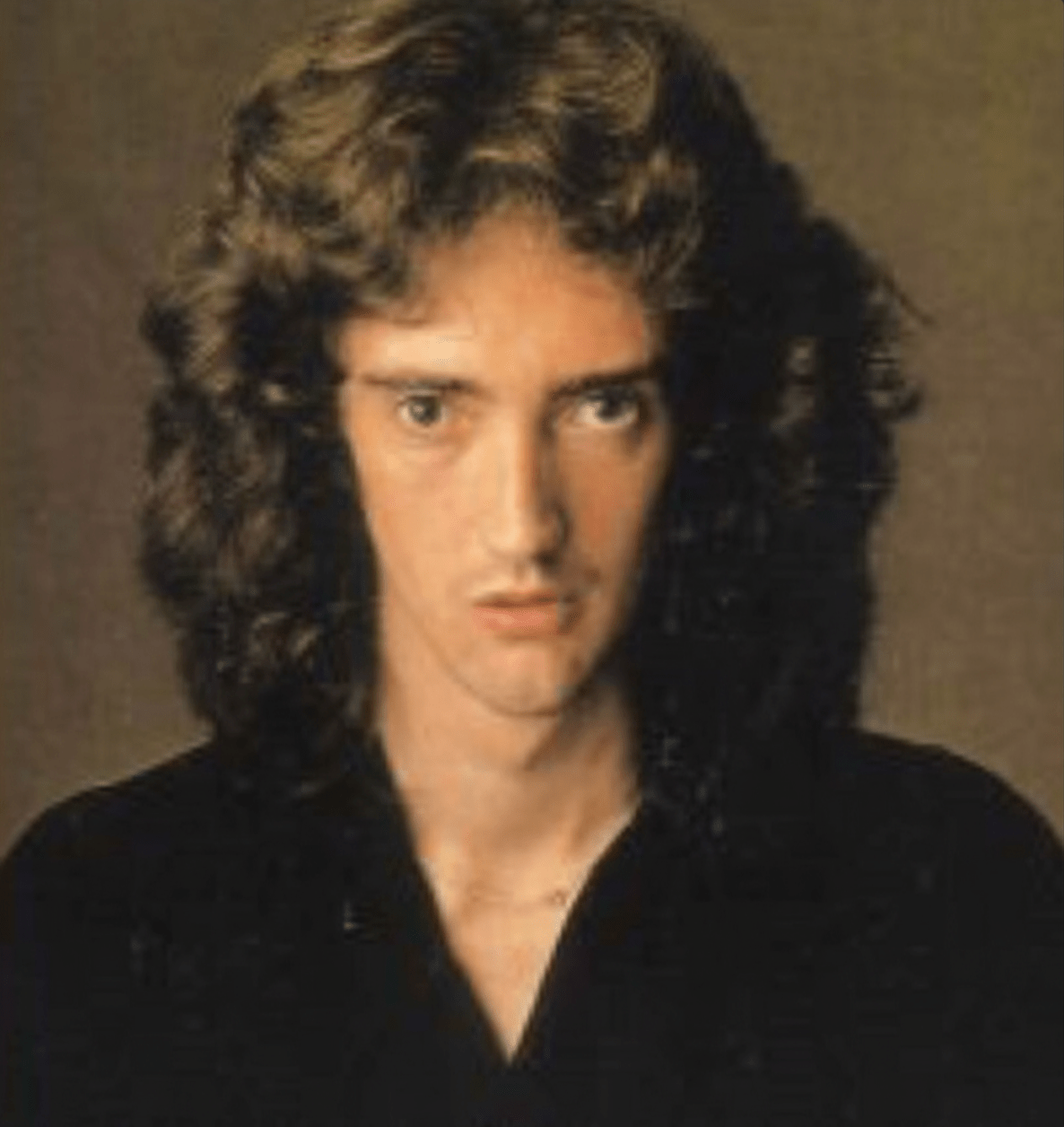 Robert Taylor of Dragon posing for the camera, smiling confidently.