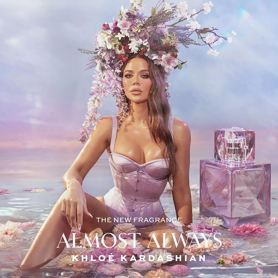 Khloé Kardashian wearing a low-cut lavender corset on the poster for her new fragrance, Almost Always.