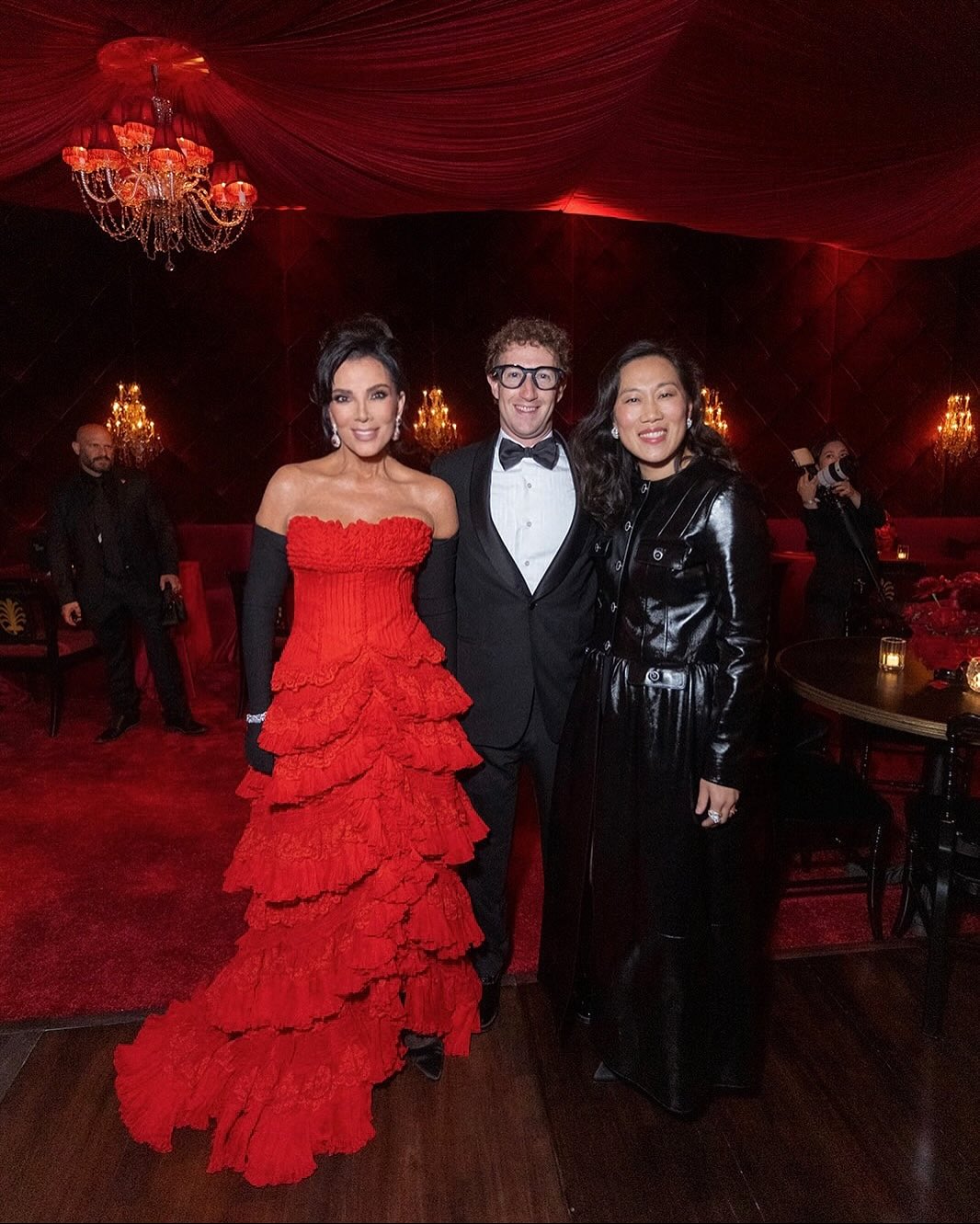 Kris Jenner poses with Mark Zuckerberg and his wife Priscilla Chan at her 70th birthday party, smiling together amid the opulent Bond-themed décor.
