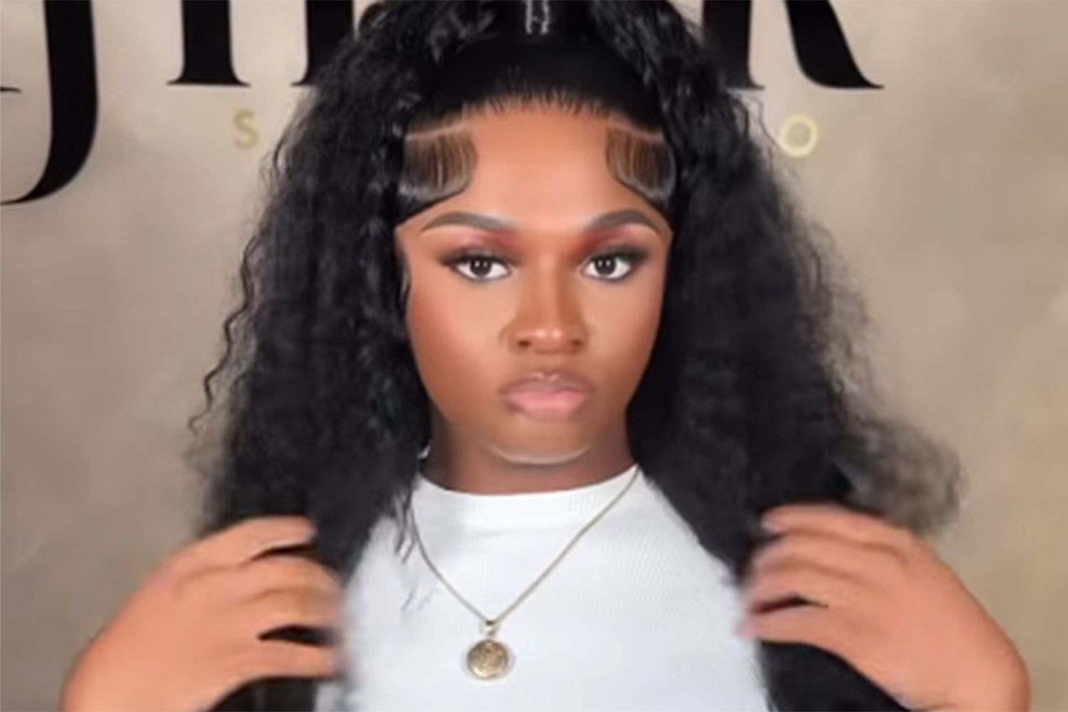 Image CaptionMaurice "Girlalala" Harrison exudes sultry confidence in this TikTok selfie, her pouted lips and bouncy black curls framing a gaze full of fire—capturing the magnetic allure that drew fans to her world of raps and resilience, now echoing in the financial tributes and community support rising in her honor after a life taken too soon.