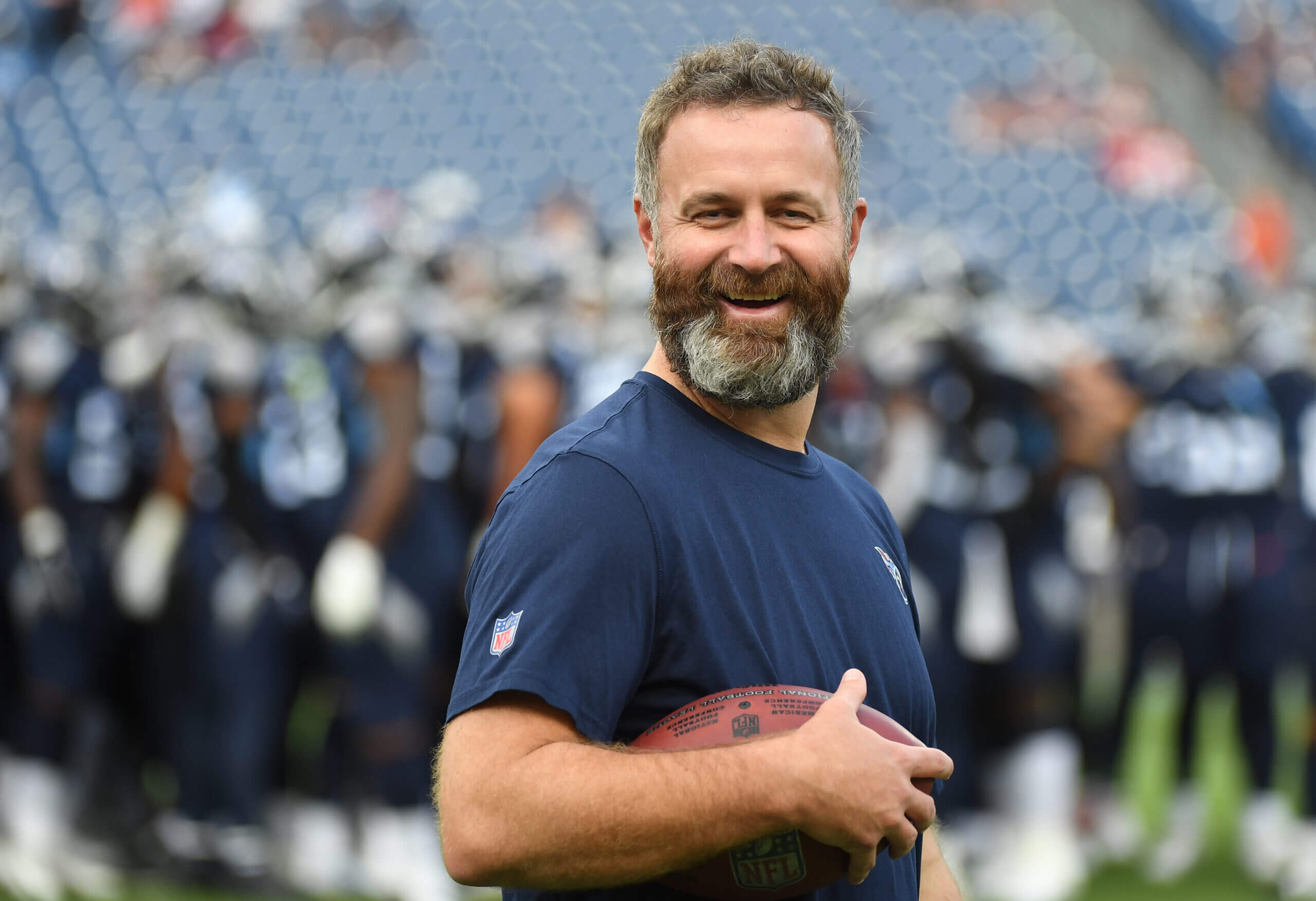 Shane Bowen smiling during a New York Giants team training session, interacting with players.