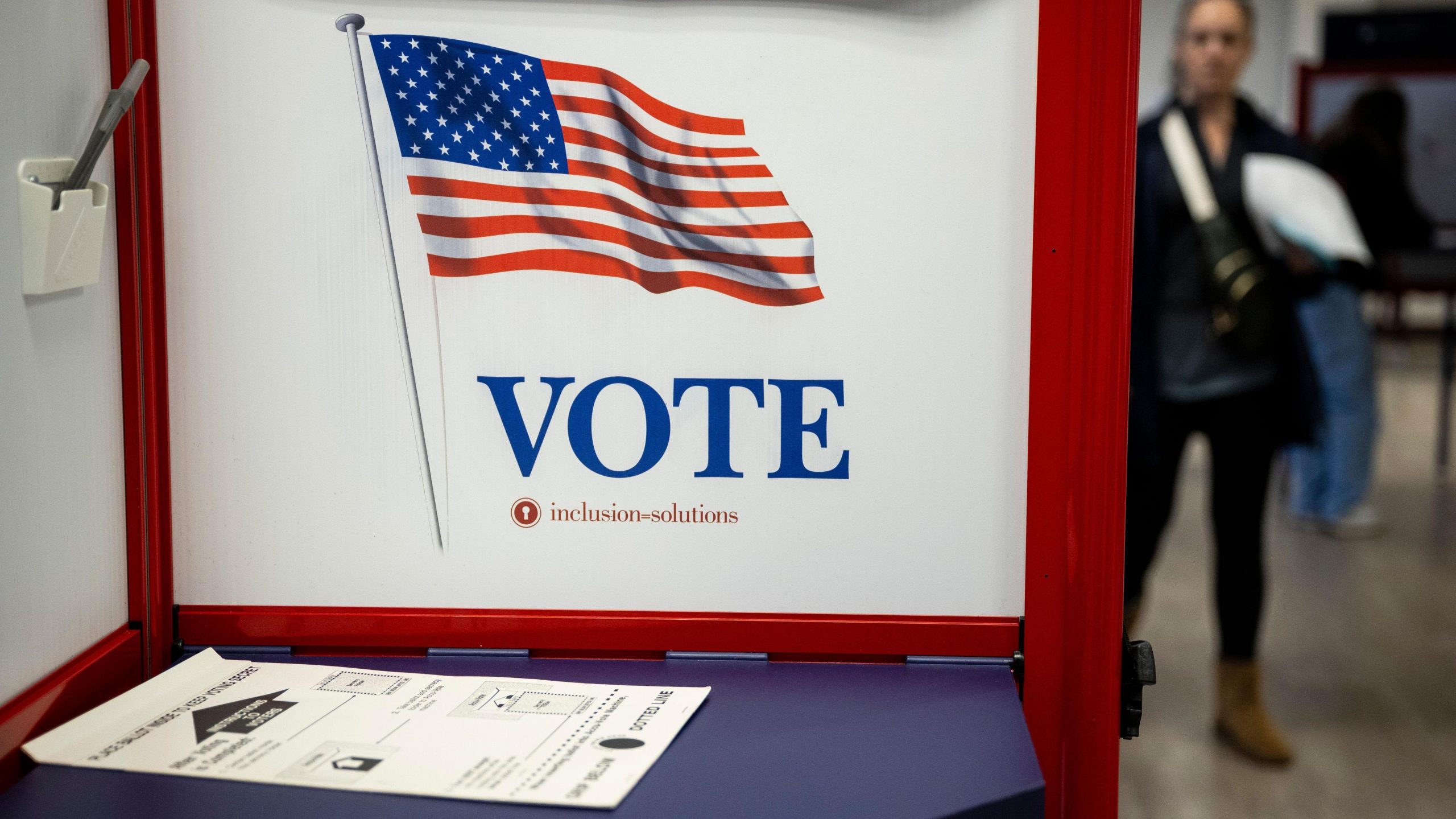 A US polling station setup with ballot papers and voting booths ready for voters.