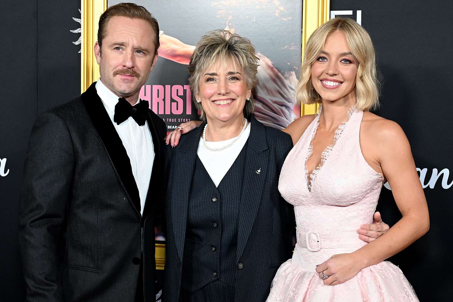 Sydney Sweeney poses with boxing legend Christy Martin on the red carpet at the premiere of their biopic.