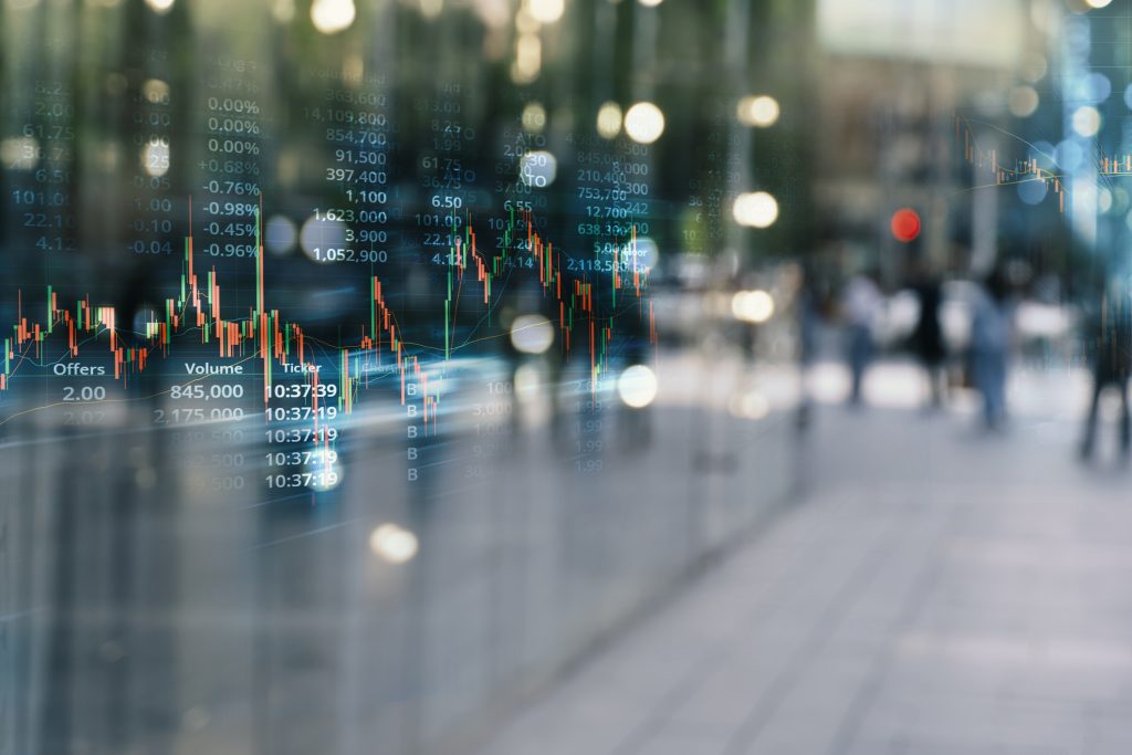 stock market graph line with blur city street background