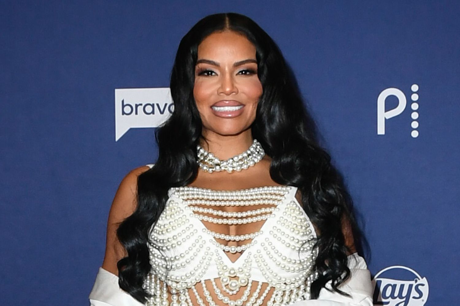 Mia Thornton smiling confidently on the red carpet during the height of her Real Housewives of Potomac fame, before the financial troubles and arrest that later unraveled her public image.