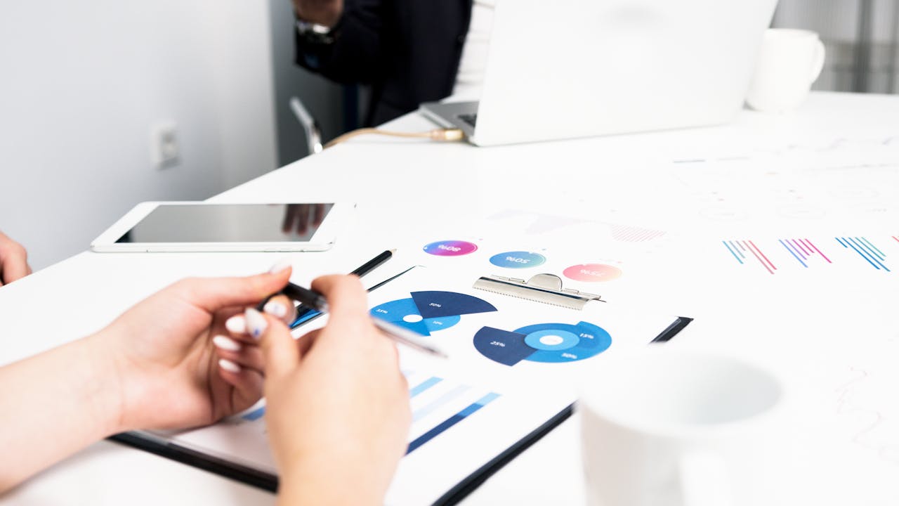 a woman reviewing some charts relating to economic data