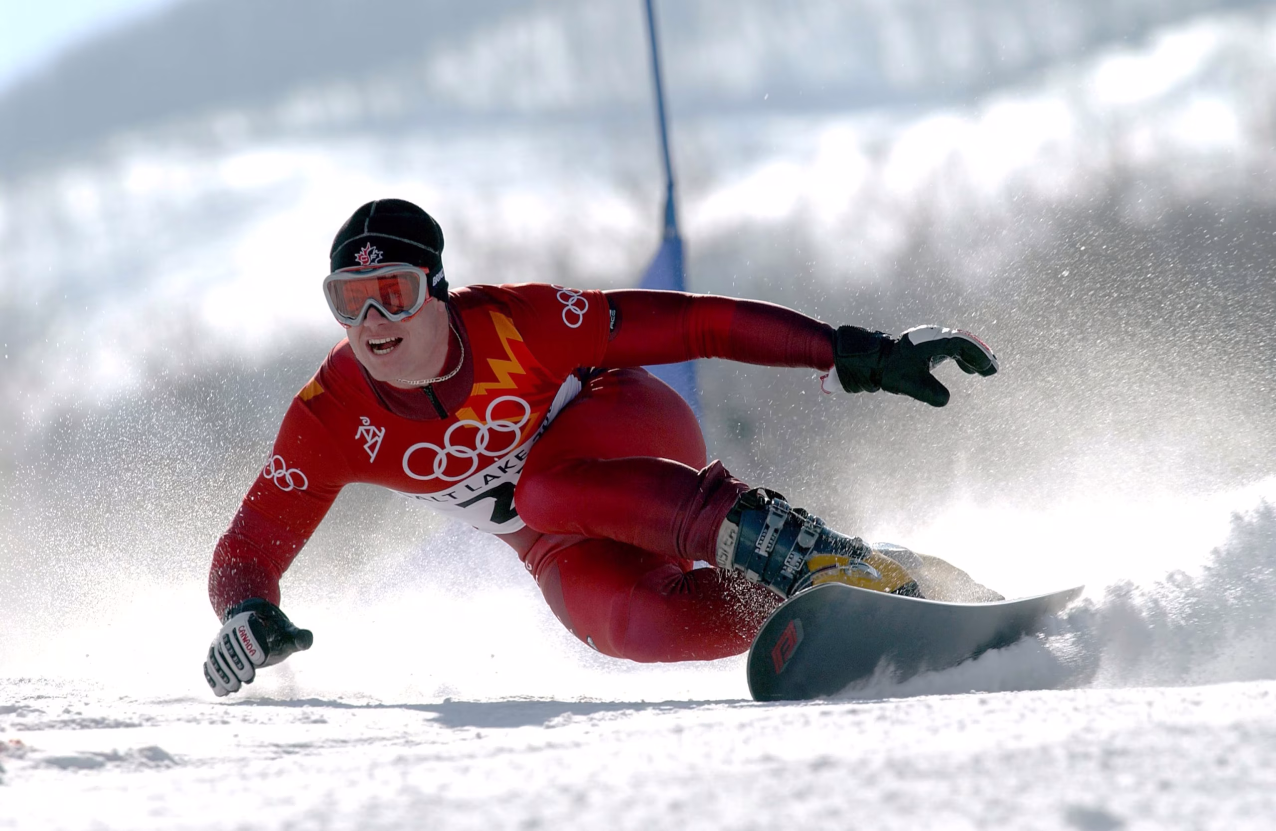 Ryan Wedding carving down a snowy Olympic course during the 2006 Winter Games, showcasing the athletic precision that contrasted sharply with his later turn into an alleged billion-dollar criminal network.