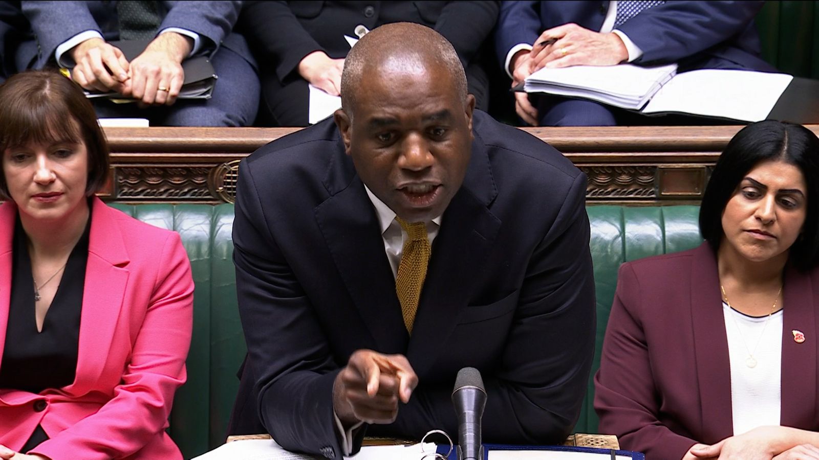 David Lammy leaning forward at the dispatch box during Prime Minister’s Questions, his expression tense and visibly angry as he addresses the chamber.
