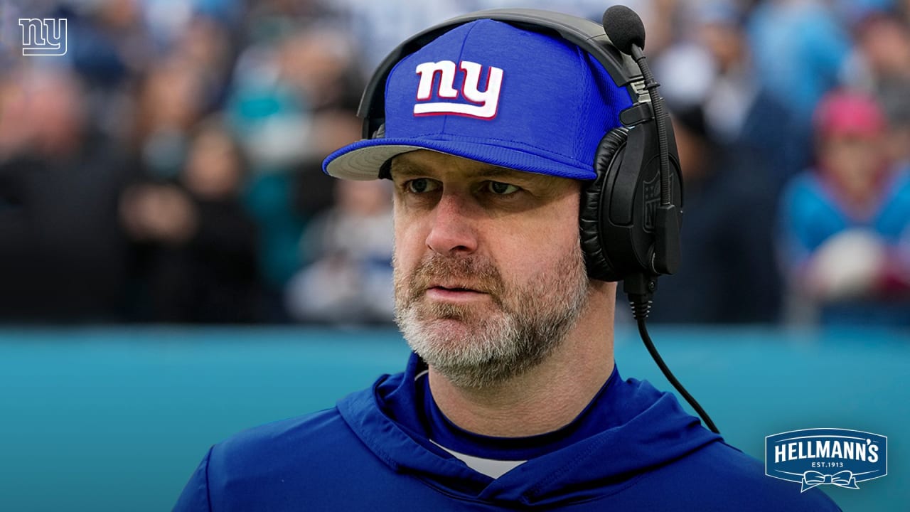 Shane Bowen coaching the New York Giants on the sidelines, wearing headphones and giving instructions during a game.