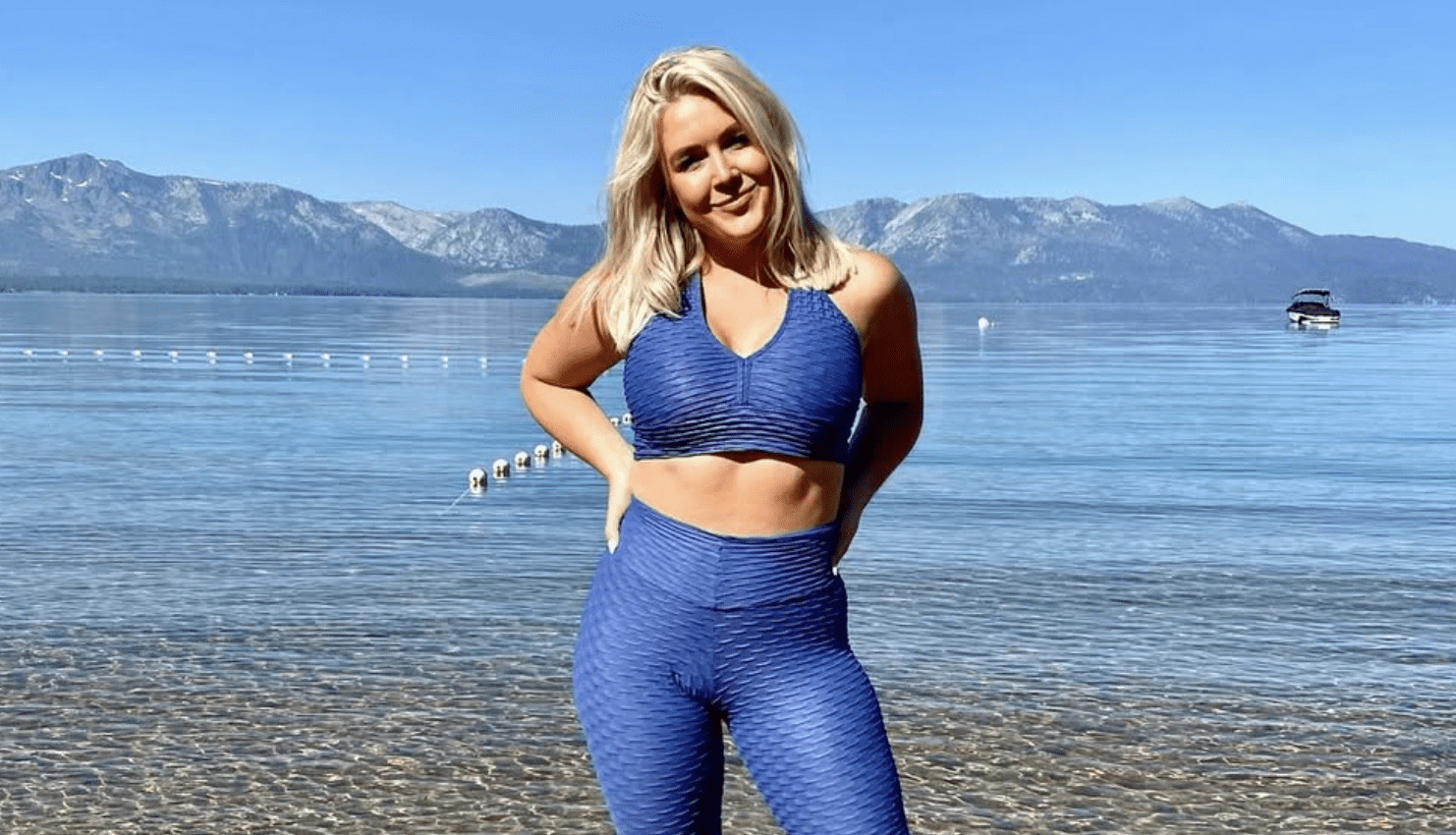 White House press secretary Karoline Leavitt in athletic gear jogging along a sunny beach, looking focused and energetic.
