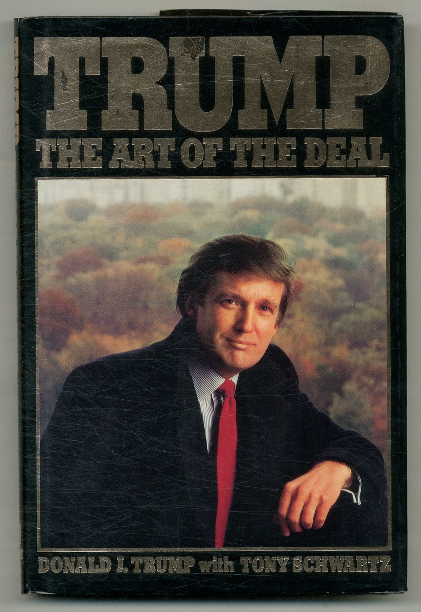Cover of Donald Trump’s 1987 book Trump: The Art of the Deal, featuring the iconic portrait photographed by Michele Singer Reiner that helped define Trump’s early public image.
