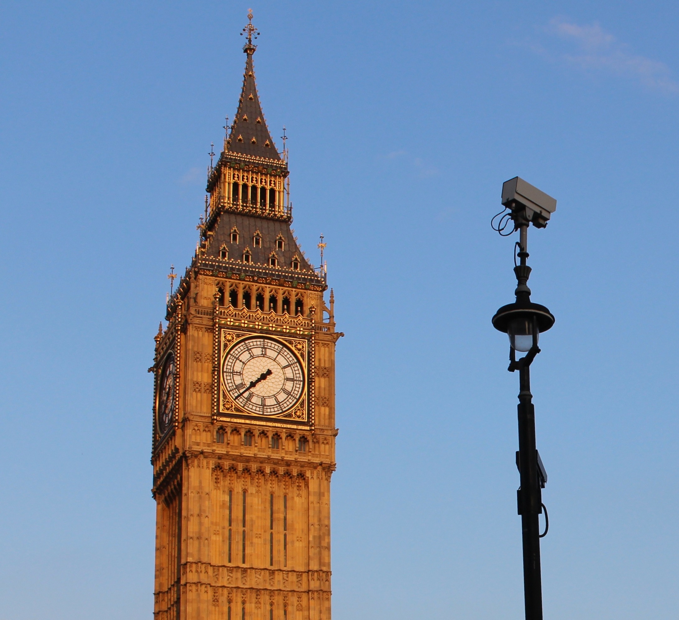 A surveillance camera positioned in front of Big Ben, symbolising the expansion of facial recognition monitoring in London.