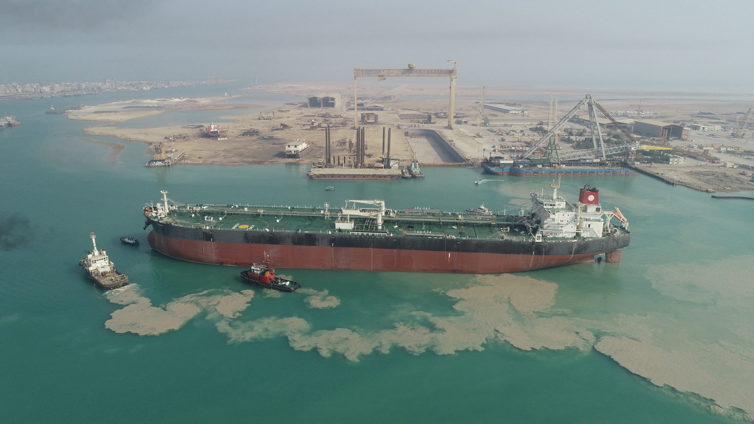 A large crude oil tanker at sea, similar in size and design to the Skipper, with a calm ocean backdrop.
