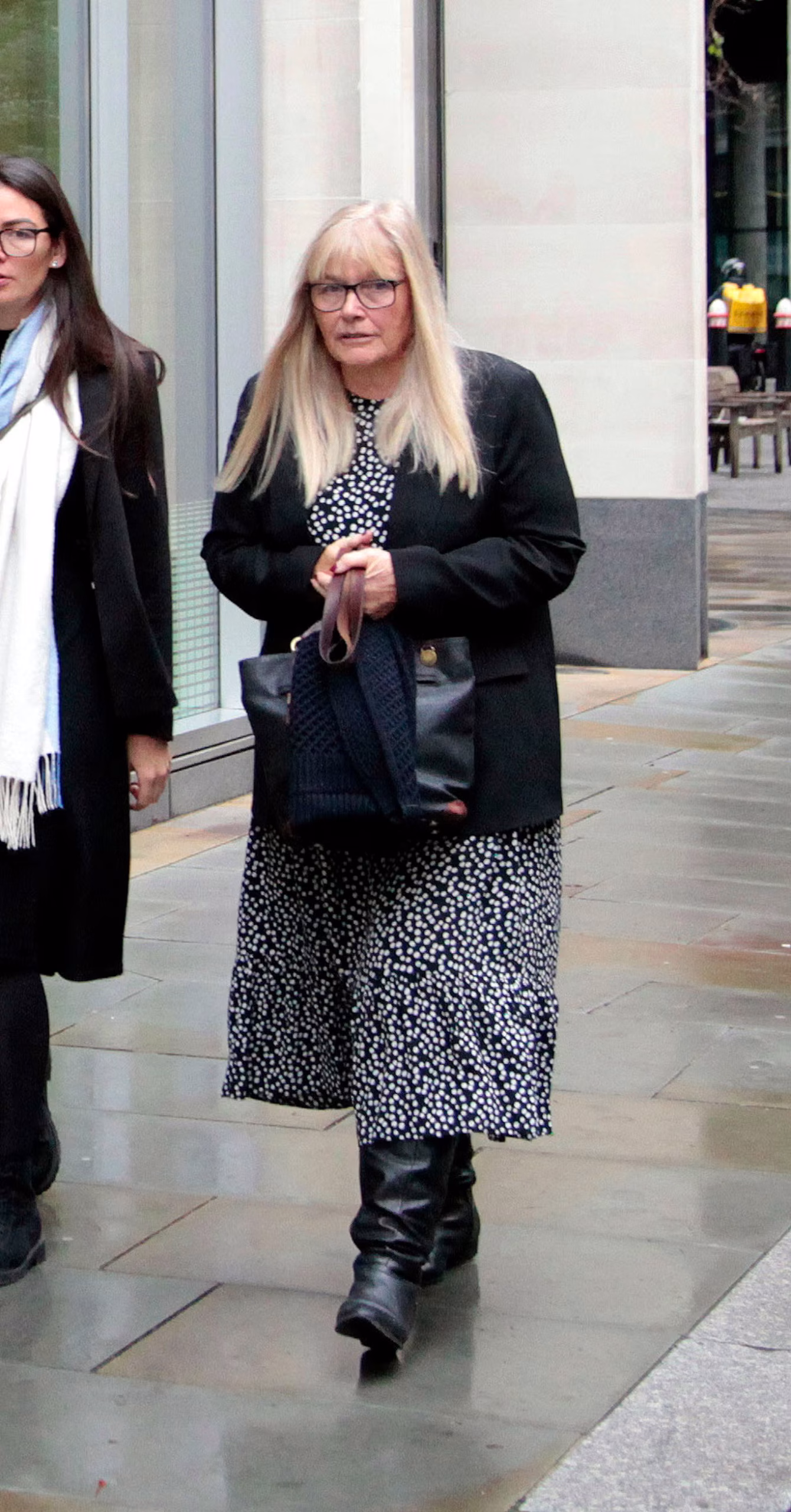 Rosemary Talbot walking into London’s High Court, looking composed and confident ahead of the inheritance dispute hearing.