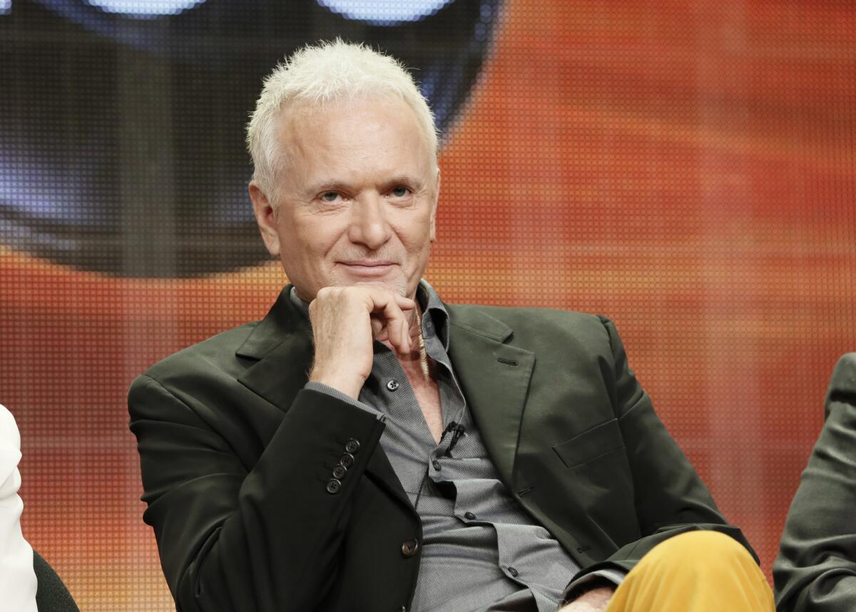 Anthony Geary attends a television industry panel, wearing a dark blazer and seated on stage.