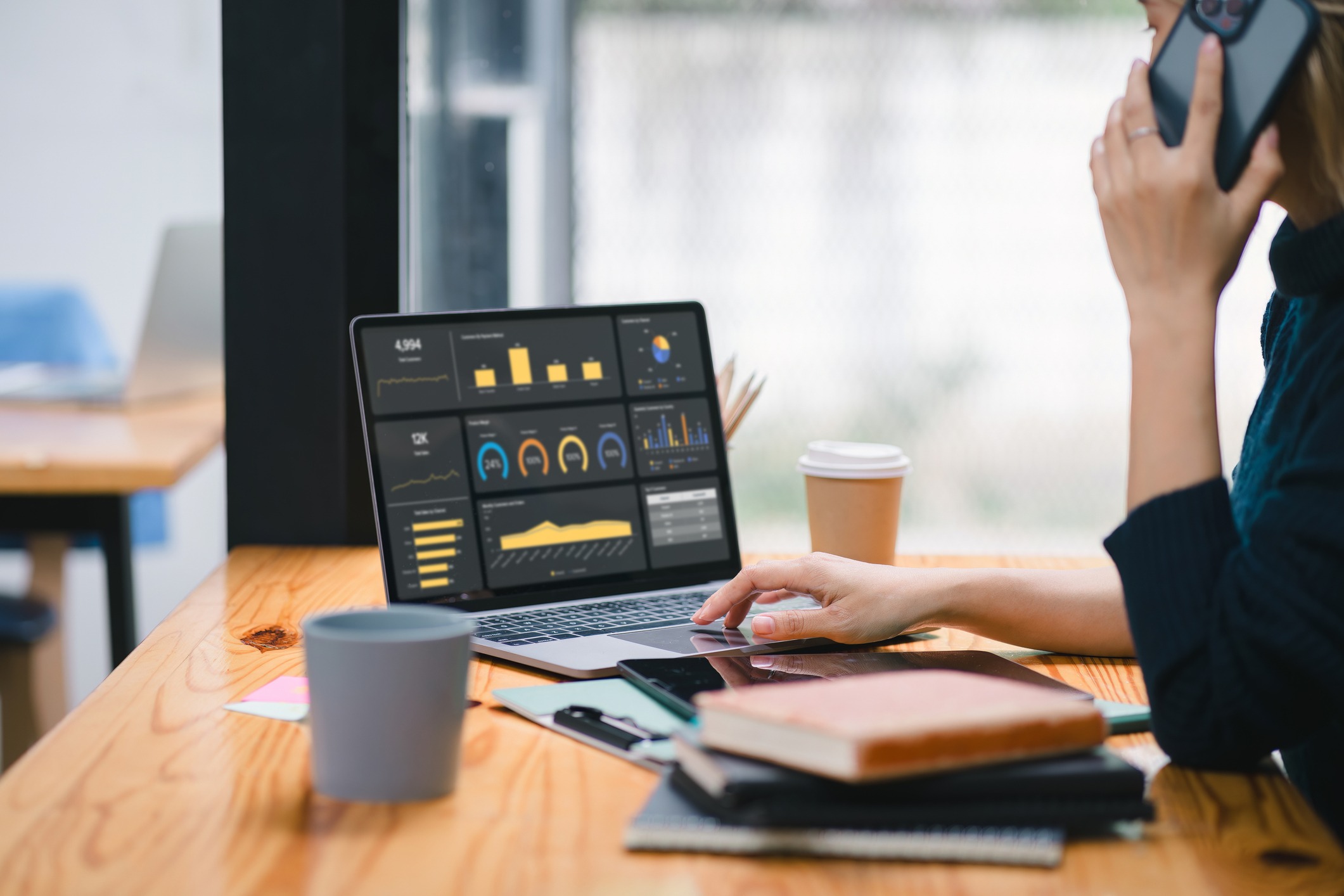 the data analyst woman working on a business analytics dashboard, utilizing charts and metrics to analyze performance and generate insightful reports for operations management.