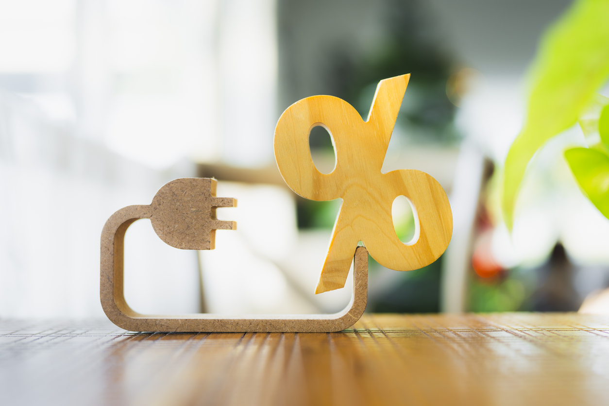 percent symbol with electricity symbol. concept of household utilities expenses monthly electricity bill, or increasing economic stimulus measures by raising interest rates