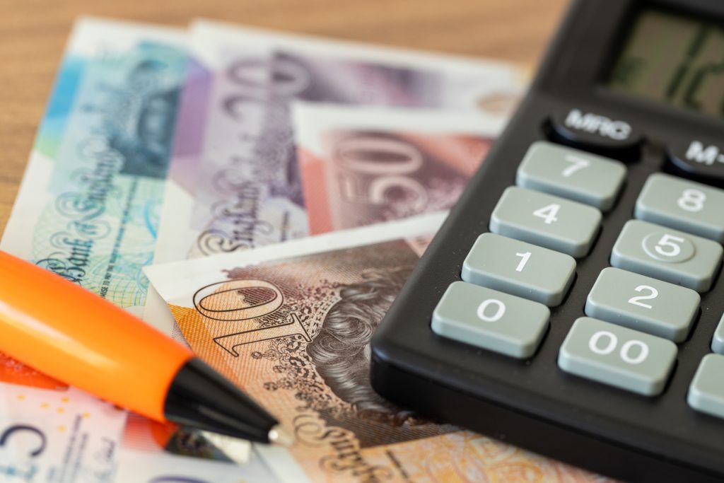 british pounds, calculator and money file, financial settlements, household budget, taxes, british currency exchange rate, financial analysis, economic and business concept uk