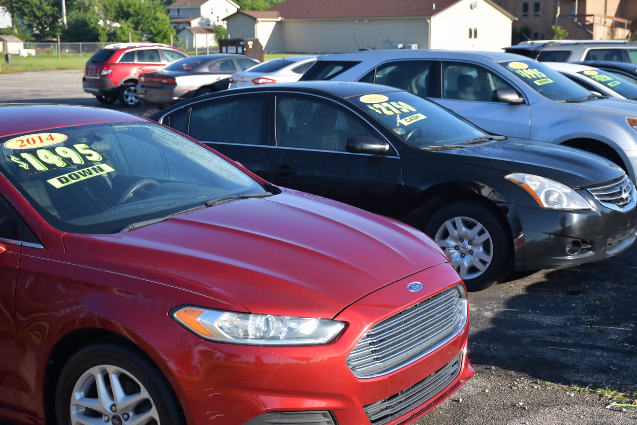 automobiles at a used car lot.