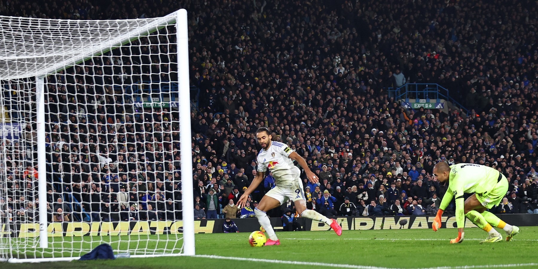 Dominic Calvert-Lewin scoring Leeds United’s third goal against Chelsea, slotting the ball into an open net.