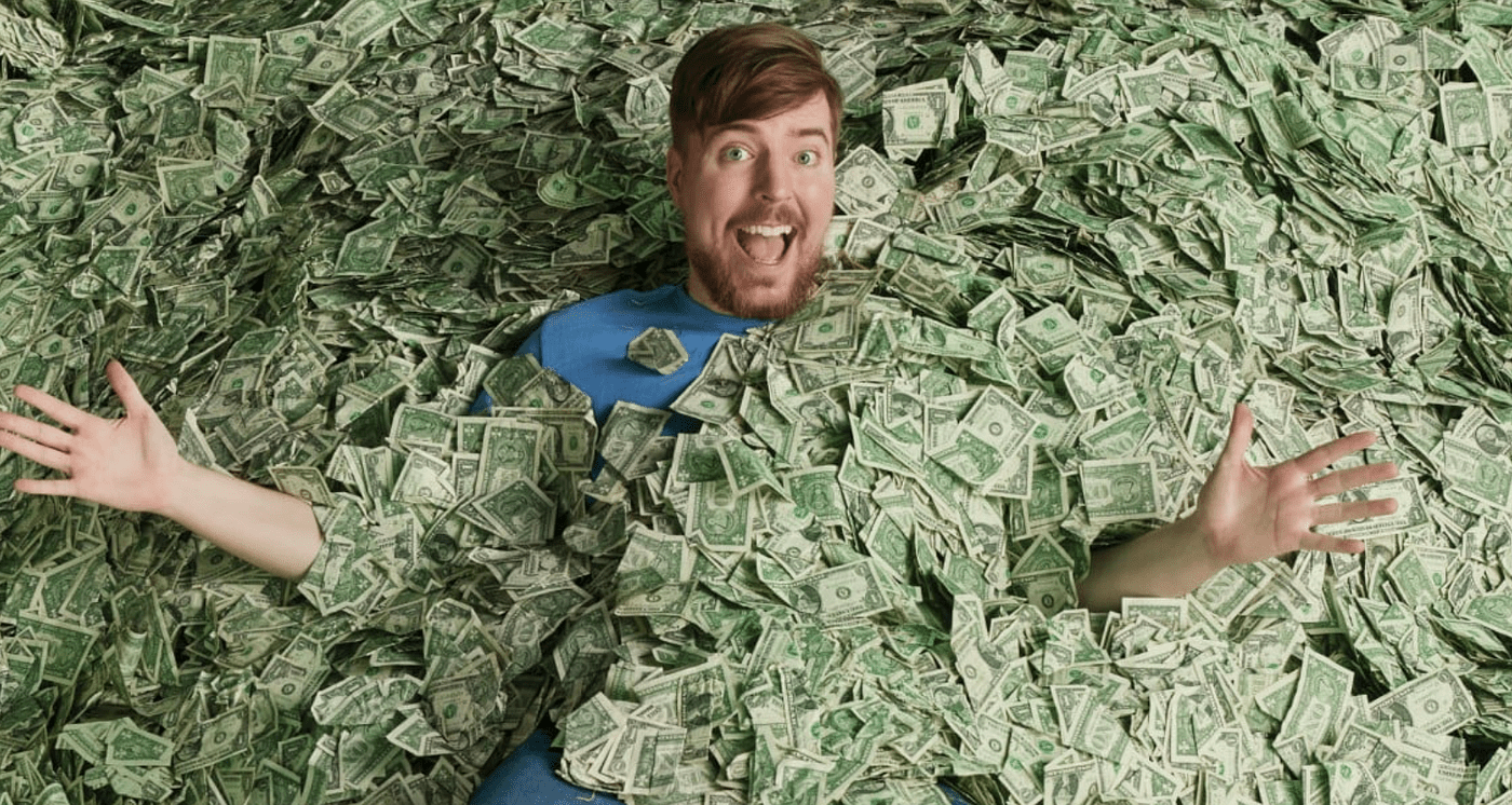 MrBeast lying in a pile of cash during a YouTube video challenge, illustrating his public image of wealth.