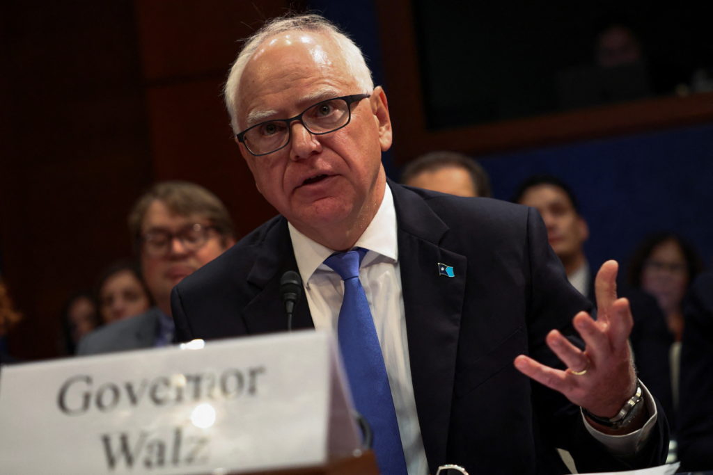 Minnesota Governor Tim Walz speaking during a public hearing at the state capitol
