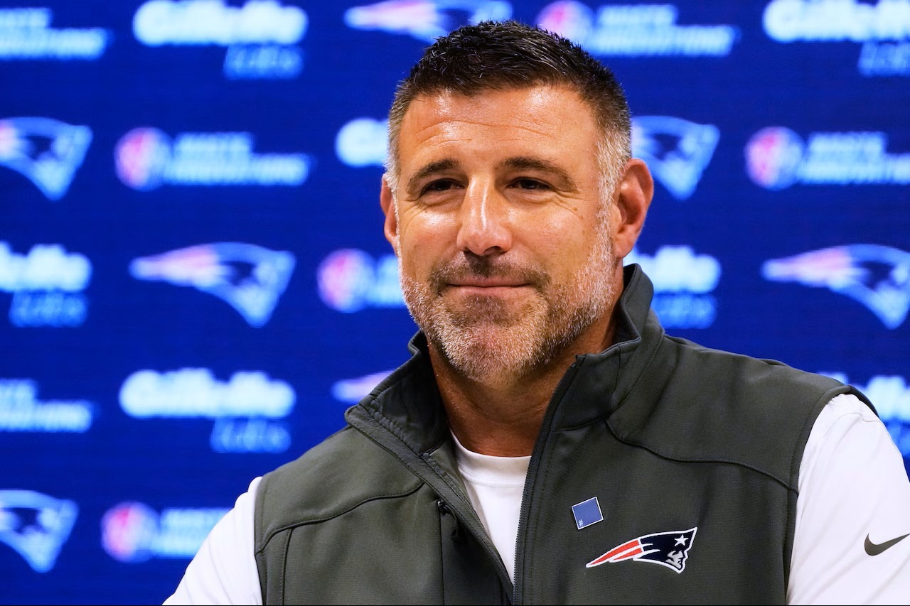 Mike Vrabel addressing reporters at a press conference as New England Patriots head coach ahead of Super Bowl LX.