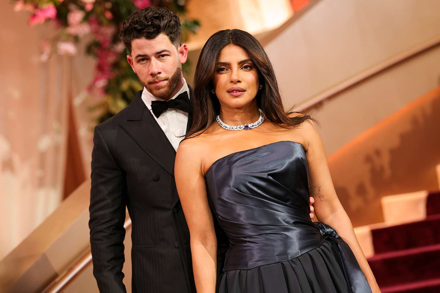 Nick Jonas and Priyanka Chopra at the 2026 Golden Globes, posing together on the red carpet amid divorce rumors and social media speculation.