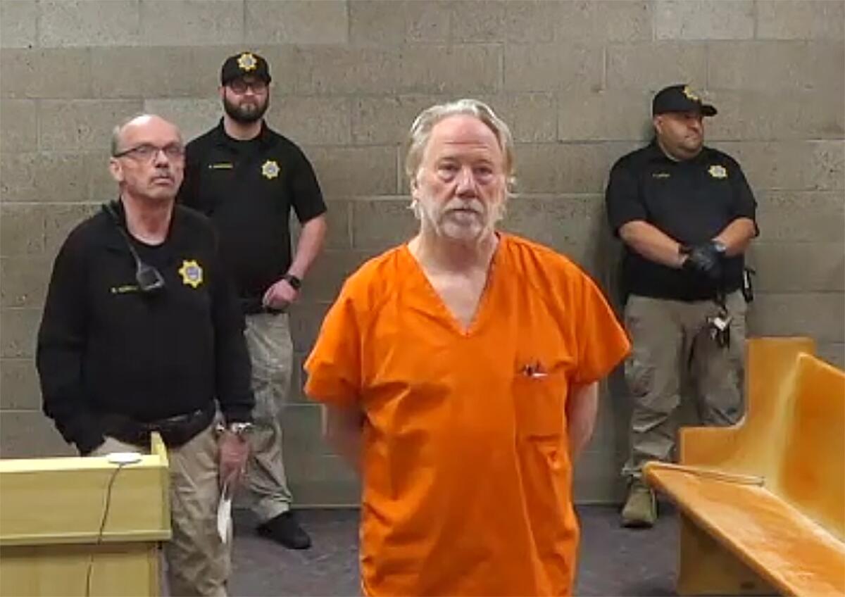 Timothy Busfield wearing an orange jumpsuit appearing in court in January 2026 amid ongoing legal proceedings