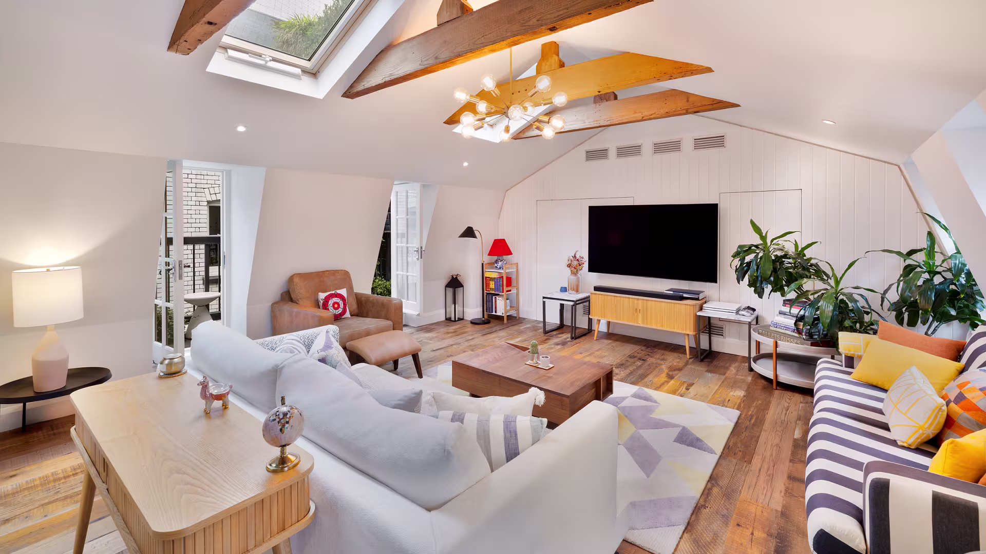 Interior of Jason Orange’s former London penthouse at Gatti House, featuring a modern living space with marble finishes and panoramic Thames views.