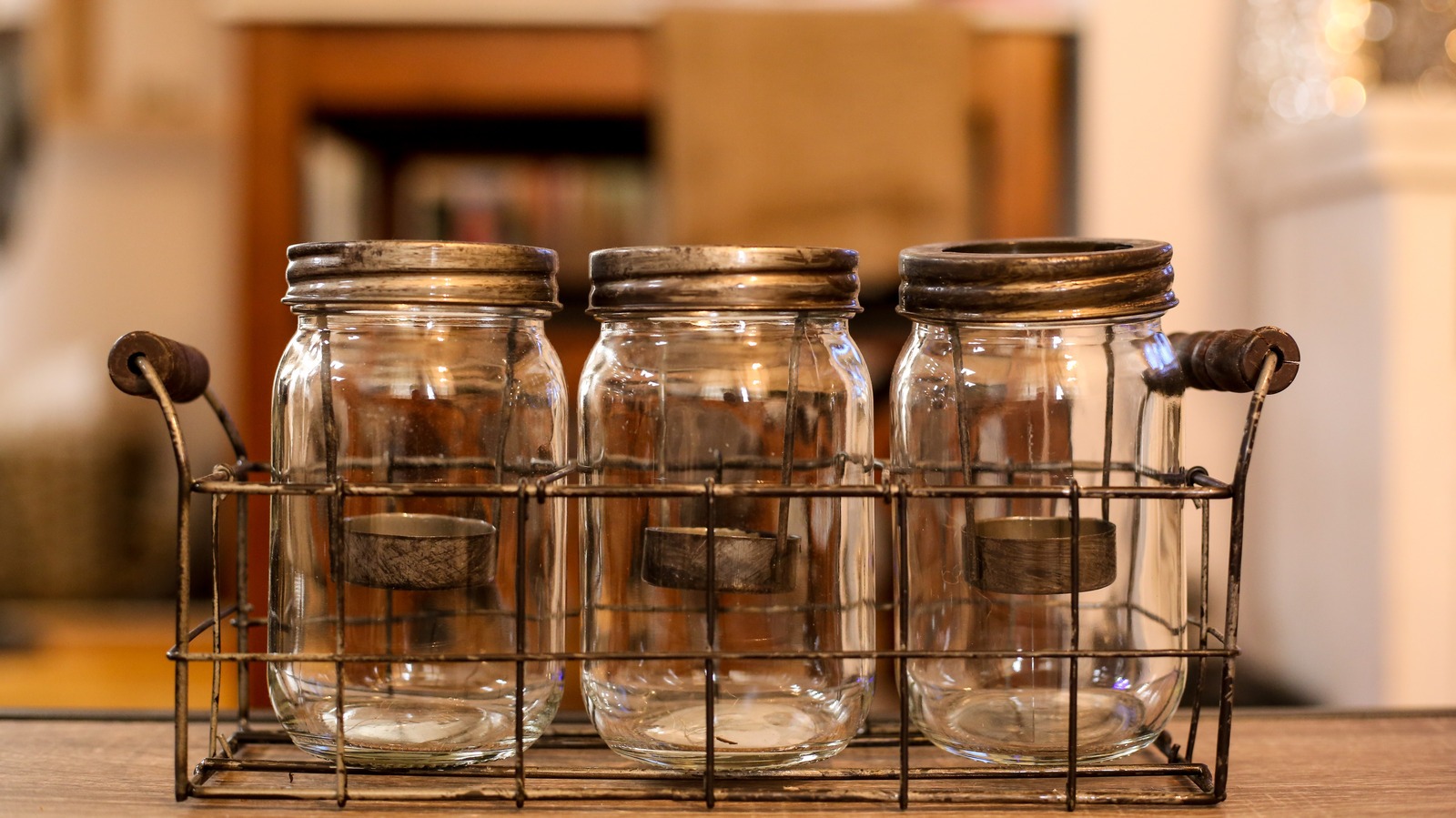 Mason jars used as decorative accents on a kitchen shelf, showing a rustic home styling choice.