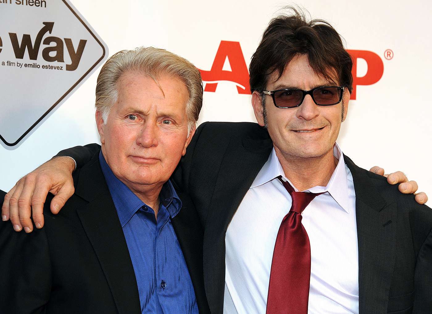 Charlie Sheen pictured with father Martin Sheen, highlighting family ties amid Charlie’s reported $147 million financial loss and struggles.