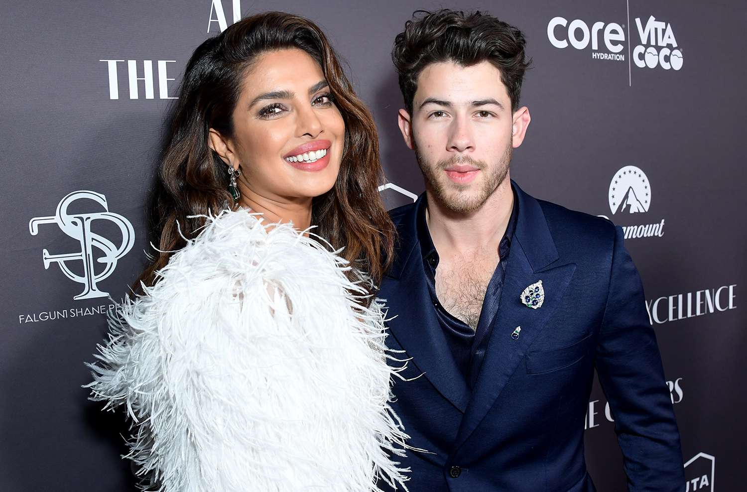 Nick Jonas and Priyanka Chopra posing together on the red carpet amid swirling divorce rumors.